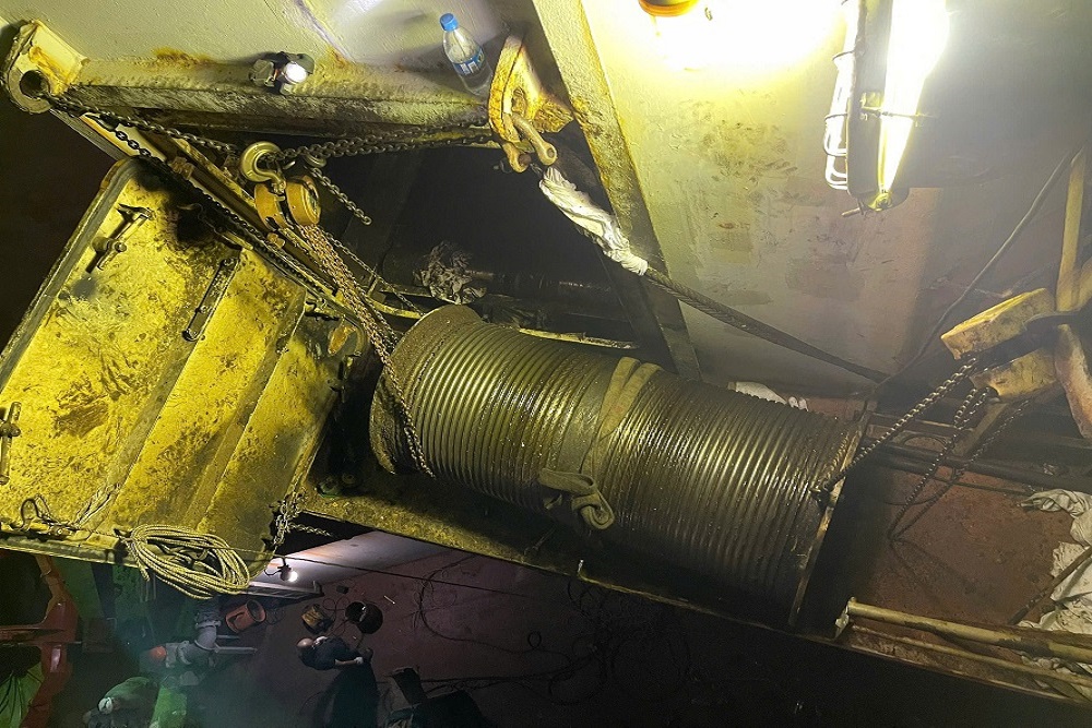Crane hoisting drum removed for repair and maintenance