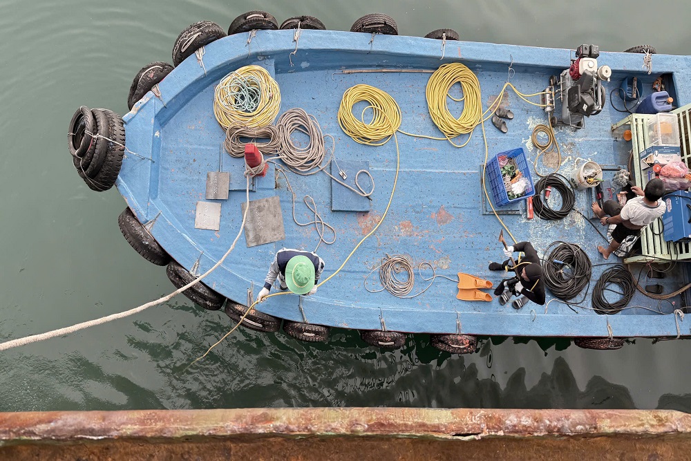 Dive support boat for underwater vessel inspection at Dung Quat Port Vietnam