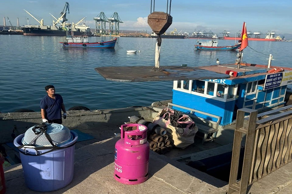 Steel plate materials transferred by boat for ship repair at Dung Quat Port