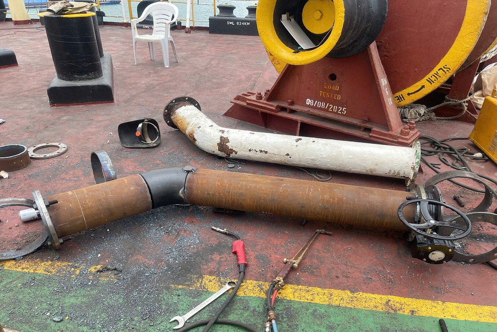 New pipe spool and valve beside a removed corroded pipe section