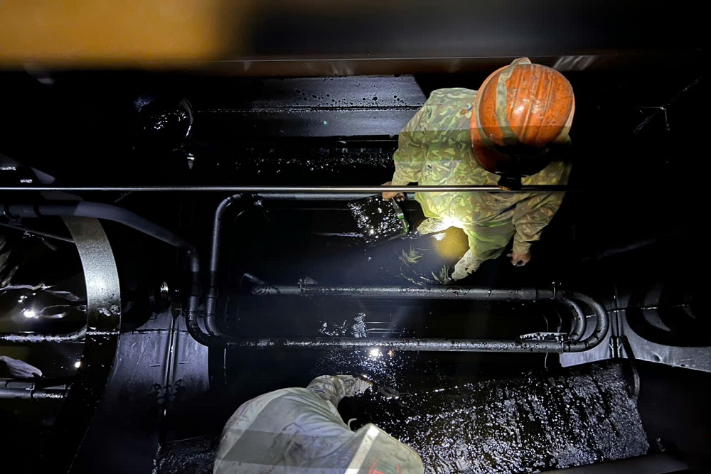 VNS technicians carrying out tank cleaning inside a confined space