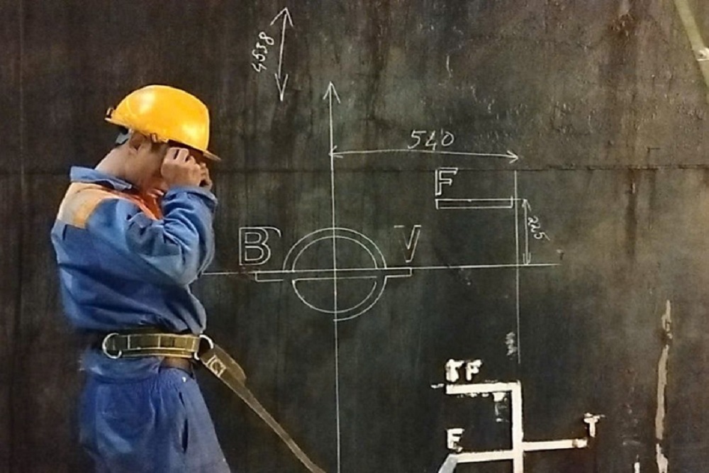 Vessel hull being marked for load line mark before welding